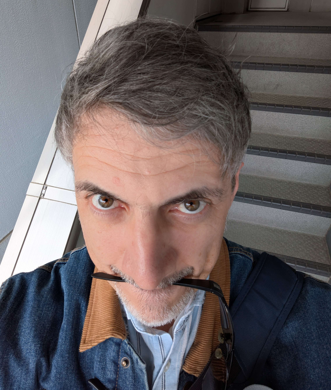 an aging man had his hair styled