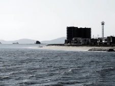 ship-passing-an-apartment-building