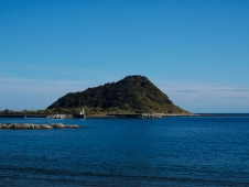 fishing-from-rocks-before-a-rugged-peninsula