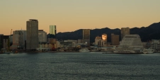 sunrise-reflected-in-glass-building,-kobe