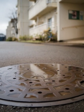 reflection-in-a-manhole-cover