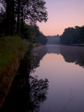 the-dawn-gathers-over-a-river