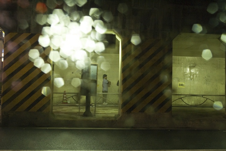 somewhere in Tokyo, through a rainy window