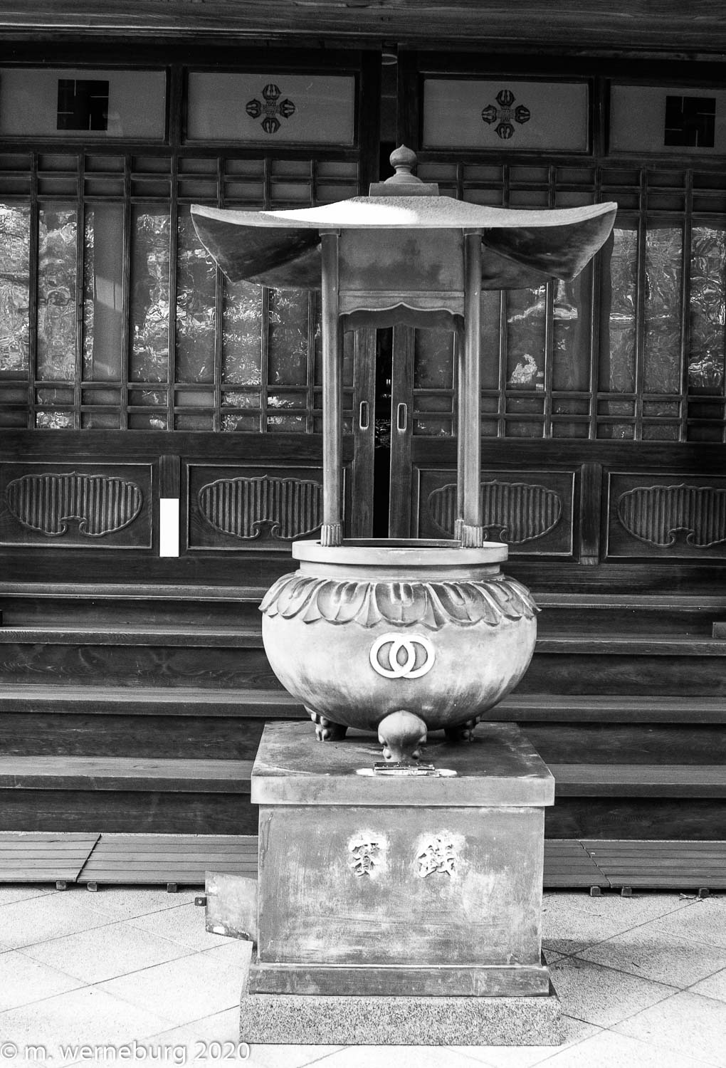 an incense urn at a small shrine