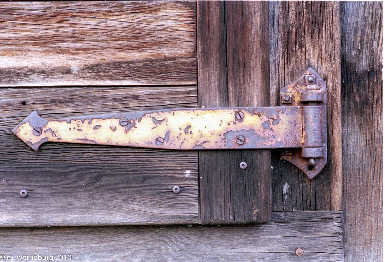 rusty lock, wooden door