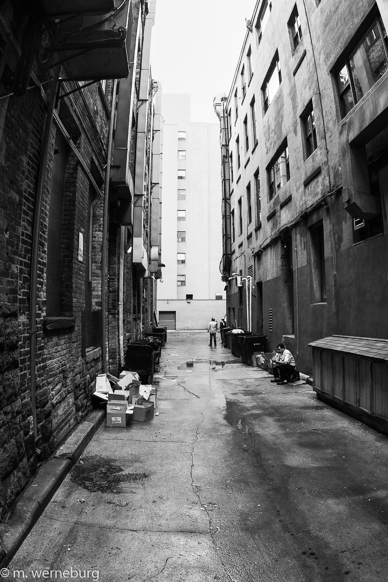 an alley behind restaurants