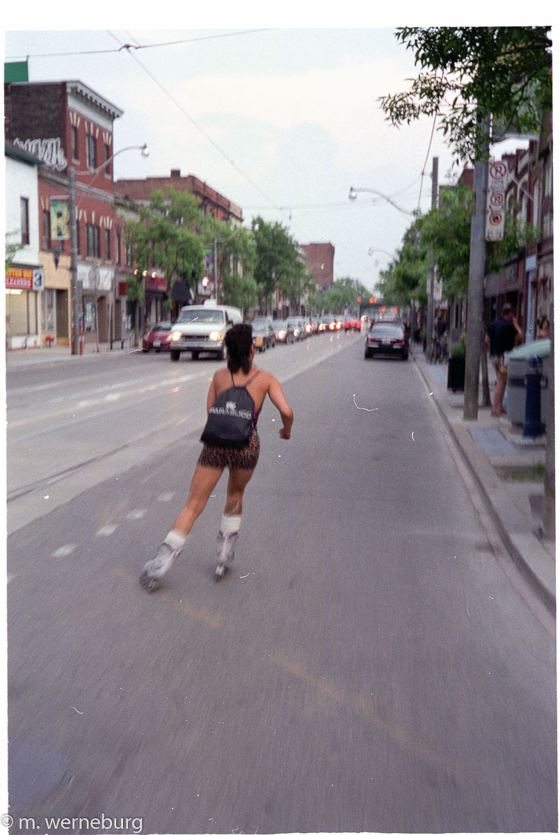 a mullet on a woman on inline skates
