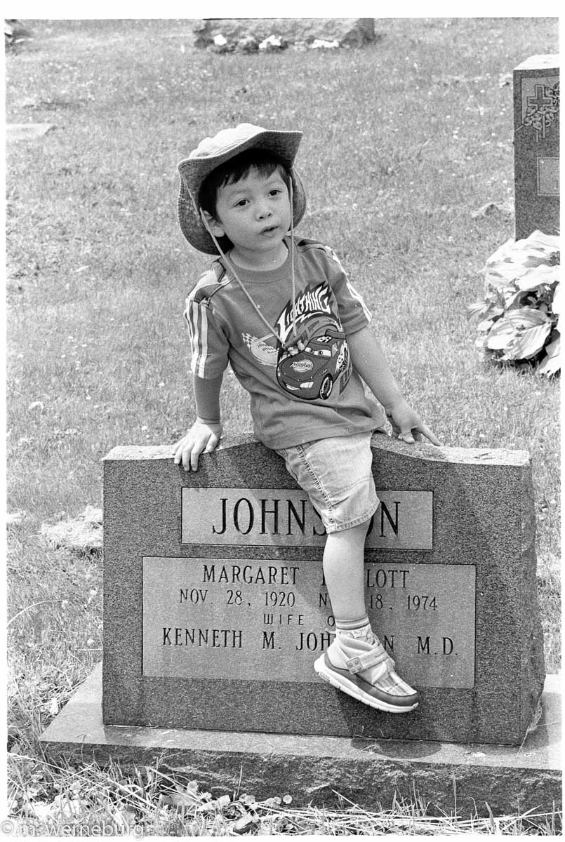 boy riding a tombstone