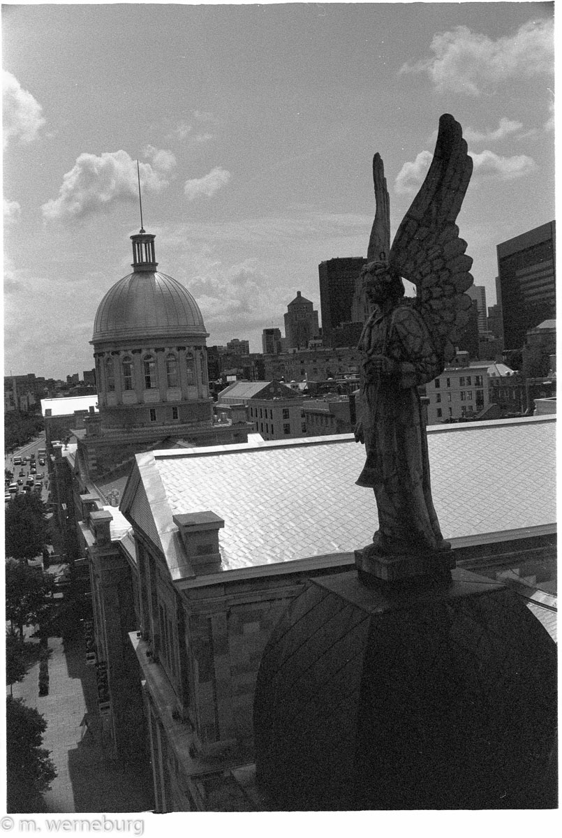 stone angel on a rooftop over Montreal