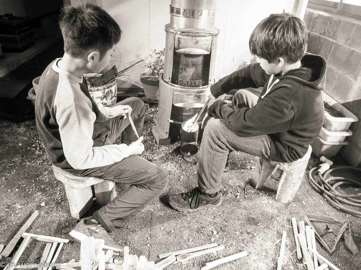 two boys and a rocket stove