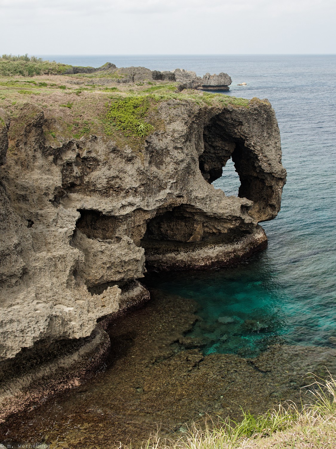 rugged point of land, with caves - Okinawa
