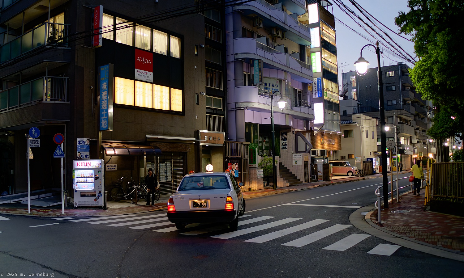 taxi plying the streets of kokubunji at dusk